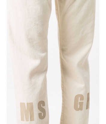 Укороченные джинсы MSGM 3241MDP57 молочные с логотипом сзади