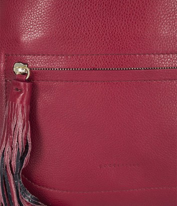 Большой кожаный рюкзак Coccinelle Leonie с брелоком-кистью красный